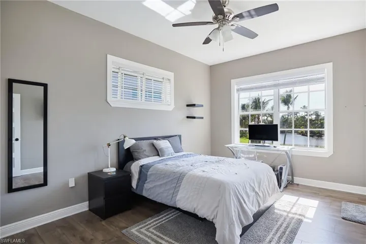 Bedroom featuring wood finished floors and ceiling fan