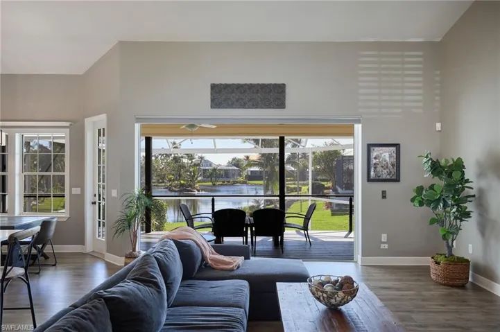 Living area with a water view, plenty of natural light