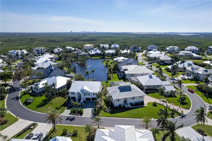 Aerial view of residential area with a large body of water