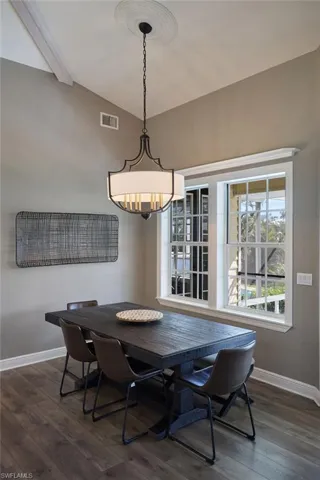 Dining space with vaulted ceiling