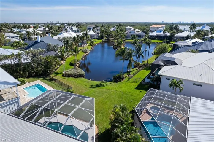 Aerial perspective of suburban area with a pool area