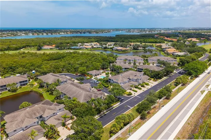 Aerial perspective of suburban area with a large body of water