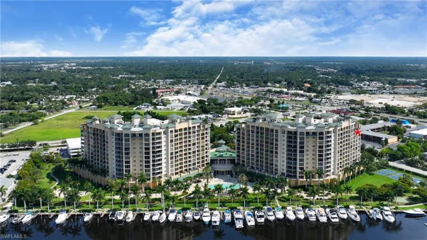 Aerial overview of property's location with numerous boat docks and a large body of water