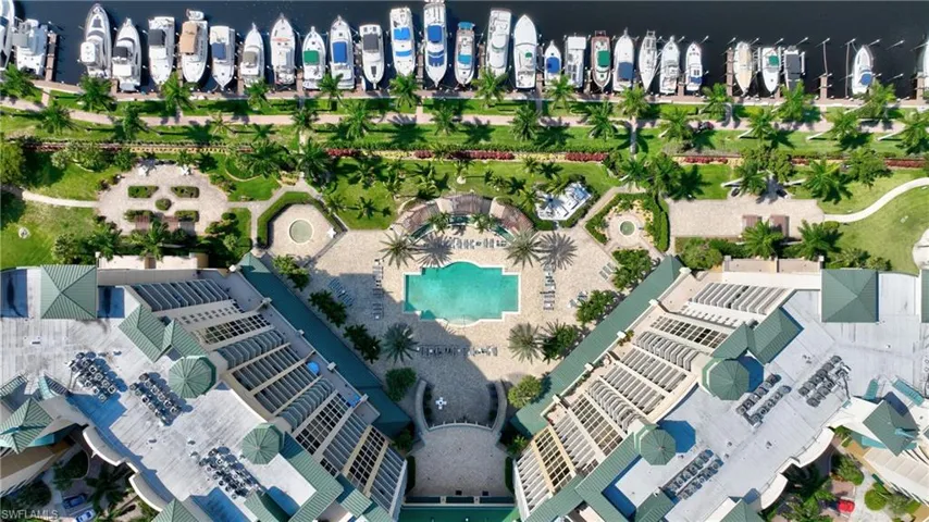 Bird's eye view of a pool and a nearby body of water