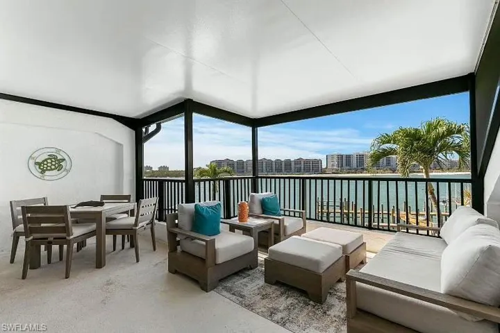 Sunroom with a water view