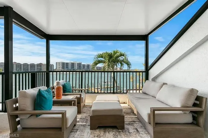 Sunroom featuring expansive windows