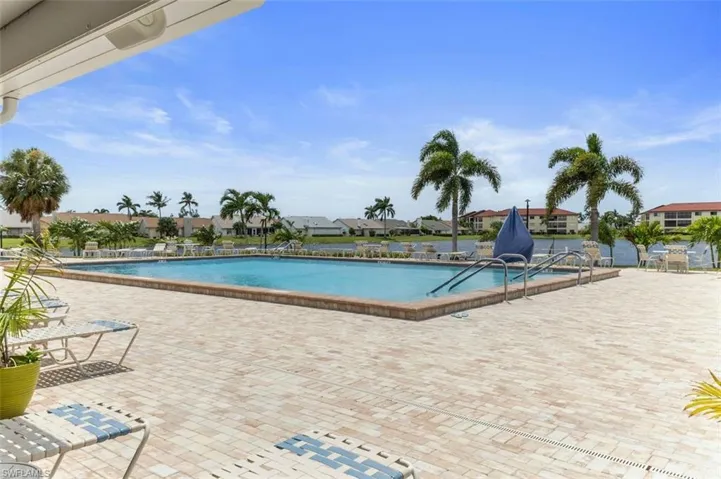 Large Swimming Pool, Paved Patio & Recliners.
