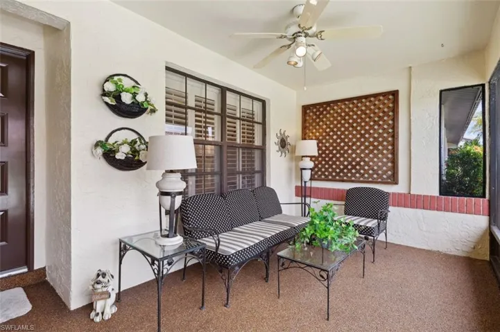 Other side of large screened lanai adjacent to front door.