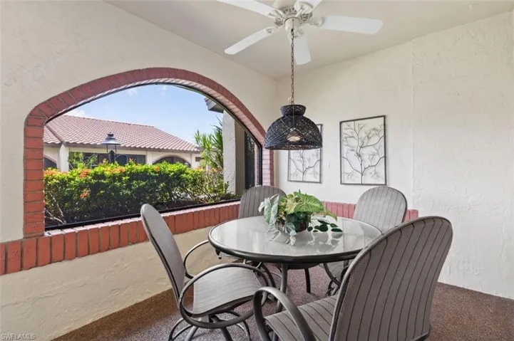 Large entertaining/outside Dining area on Front Lanai w/ ceiling fan.
