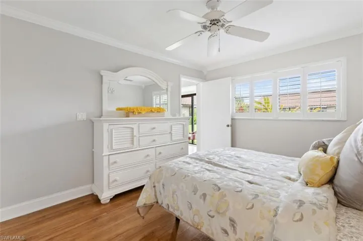 Master Bedroom featuring ceiling fan, ornamental molding, and hardwood / wood-style floors