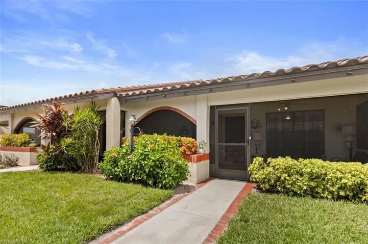 Property entrance featuring a lawn
