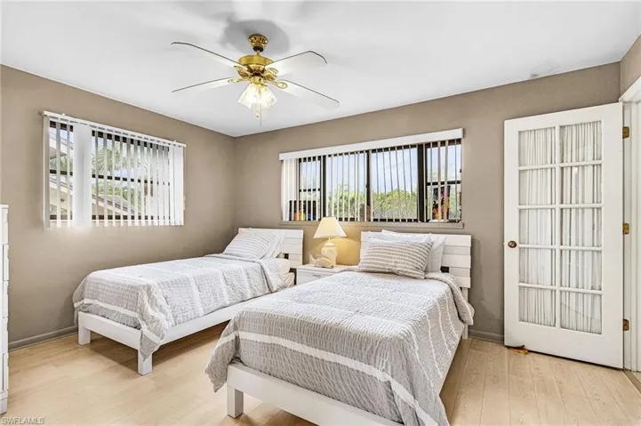 Bedroom featuring light wood finished floors and ceiling fan