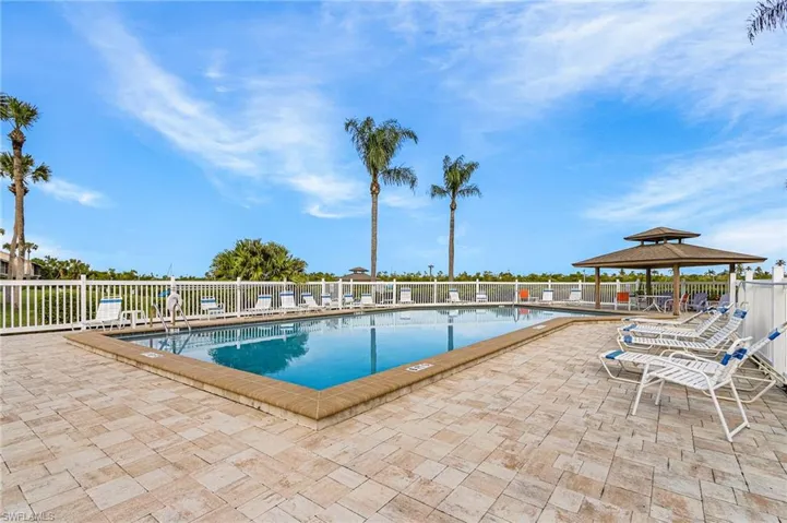 Community pool featuring a patio area and a gazebo