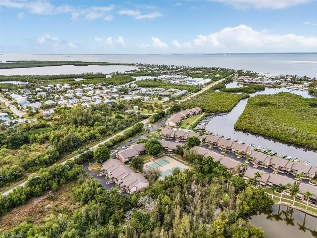 Aerial view of residential area featuring a large body of water