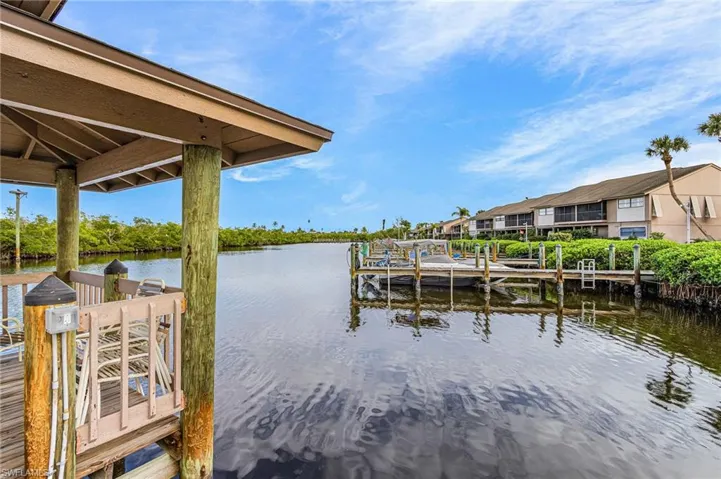 Dock area featuring a water view