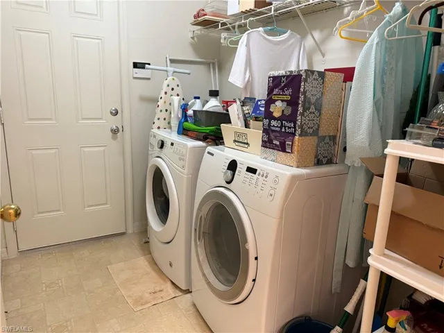 Laundry room featuring washing machine and dryer