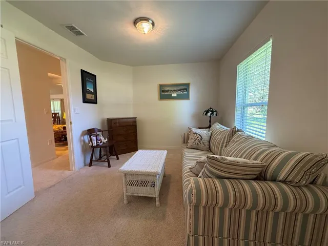 Foyer entrance featuring healthy amount of natural light, tile patterned floors, and a ceiling fan