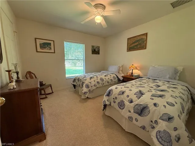 Living room featuring light carpet