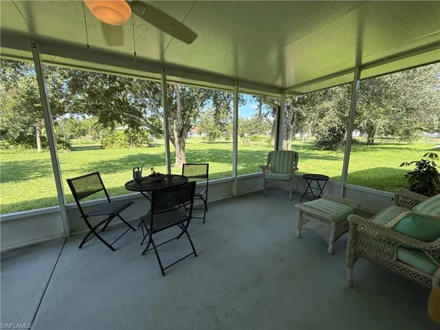 Sunroom / solarium featuring ceiling fan and healthy amount of natural light