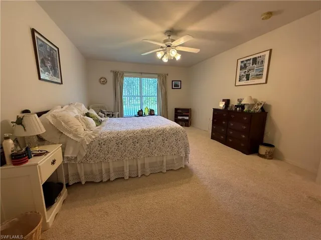 Bedroom with carpet and ceiling fan