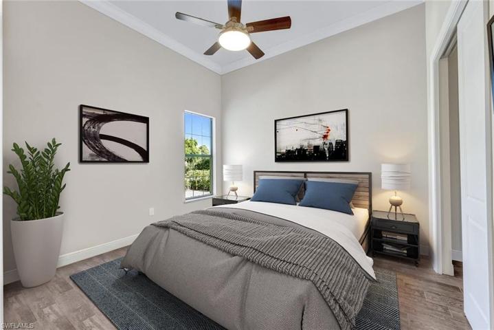 Guest bedroom #1 with crown molding, ceiling fan/light and sliding closet doors!