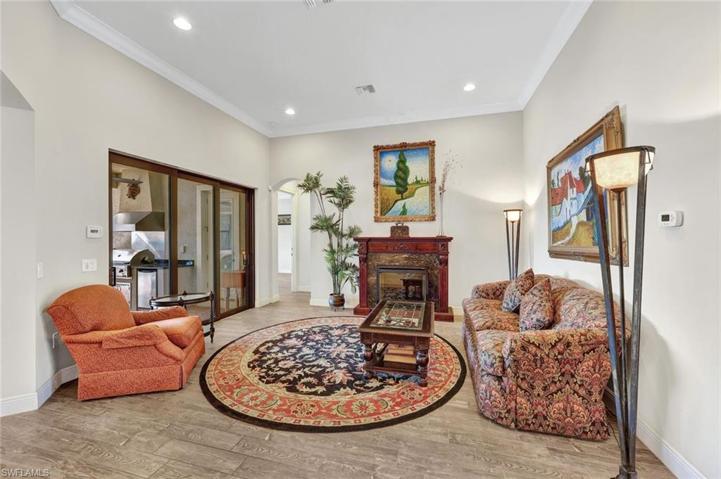 Recessed lights, crown molding, beautiful natural light and direct access to your summer kitchen and backyard oasis.