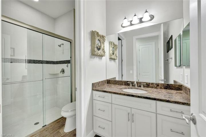 Guest bathroom #1 with private water closet and walk-in shower with glass sliding doors!