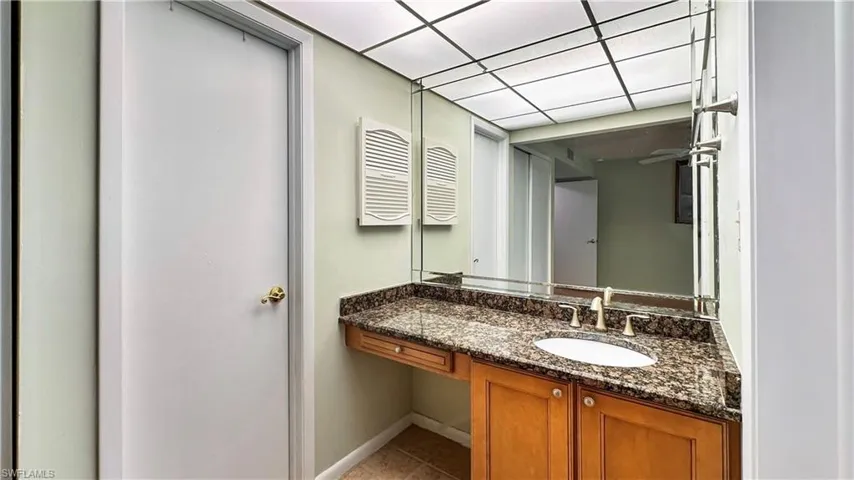 Bathroom with vanity and tile patterned flooring