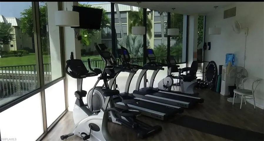 Gym with hardwood / wood-style floors
