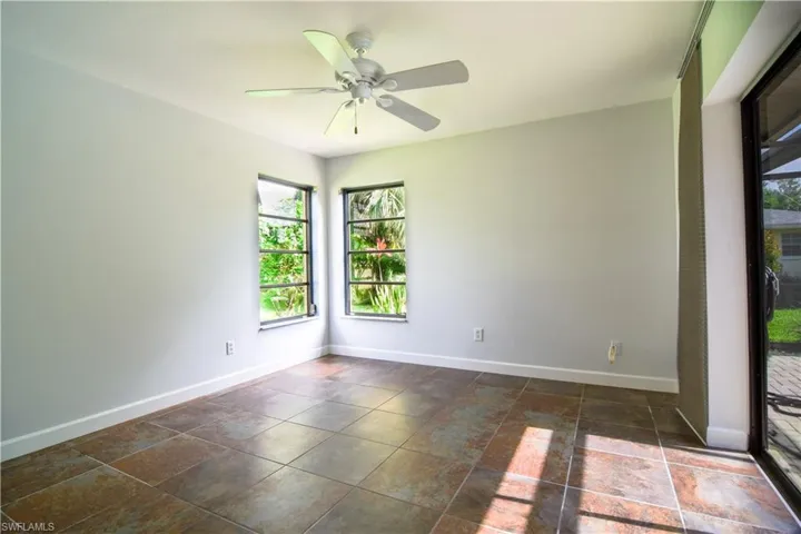 Guest bedroom #2 with NEW Impact Glass Windows & ceiling fan.