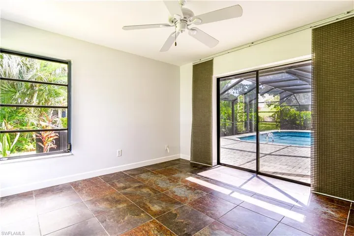 Guest bedroom #2 with sliders overlooking swimming pool.