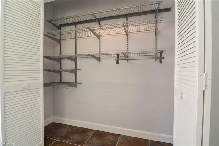 Guest bedroom #2 with lighted closet.