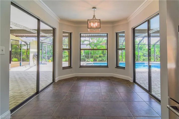 Unique breakfast nook with 2 sets of sliders for indoor and outdoor entrtaining.