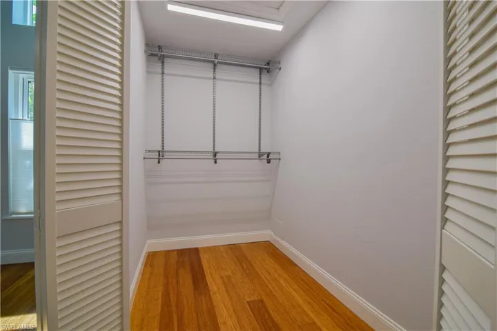 Primary bedroom walk-in closet.