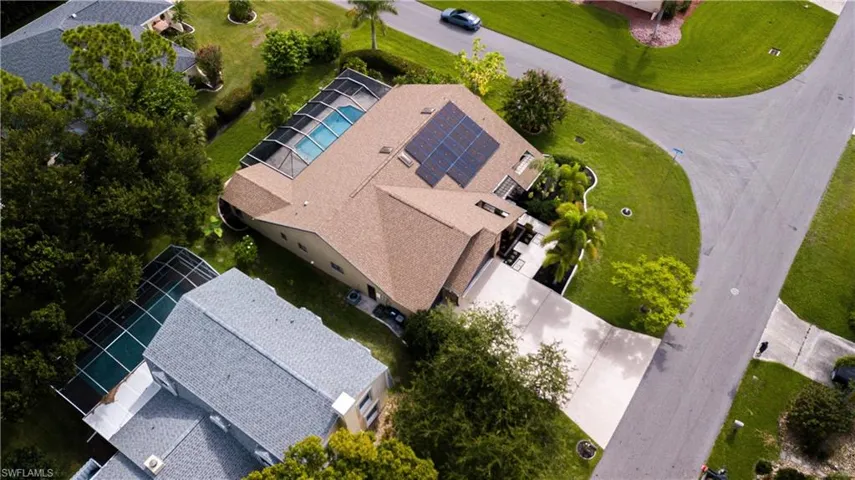 Aerial view featuring bank of 21 newer solar panels for electrical energy efficiency.