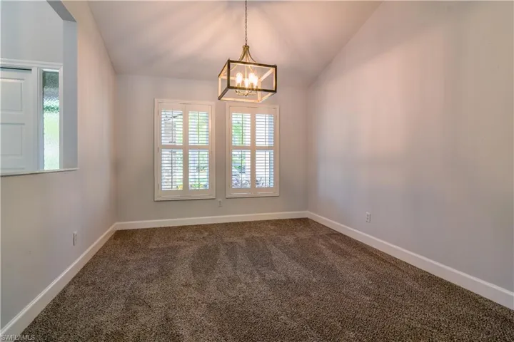 2 of 3 versatile living spaces with new light fixture and carpeting.