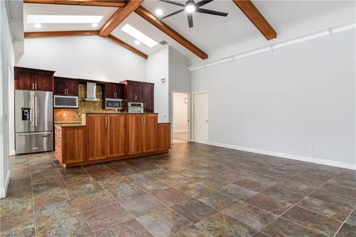 3 of 3 versatile living spaces with decorative, lighted display shelf at ceiling.