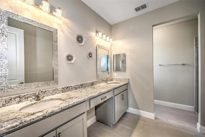 Featuring vanity and tile patterned flooring