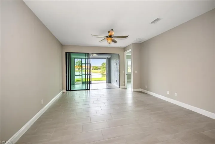Spare room with ceiling fan