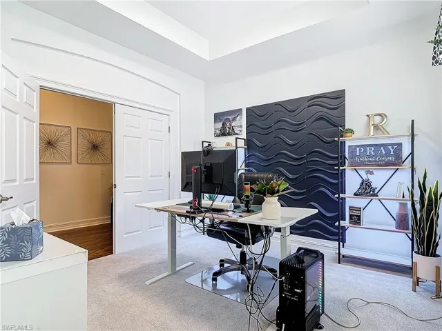 Office with hardwood / wood-style flooring