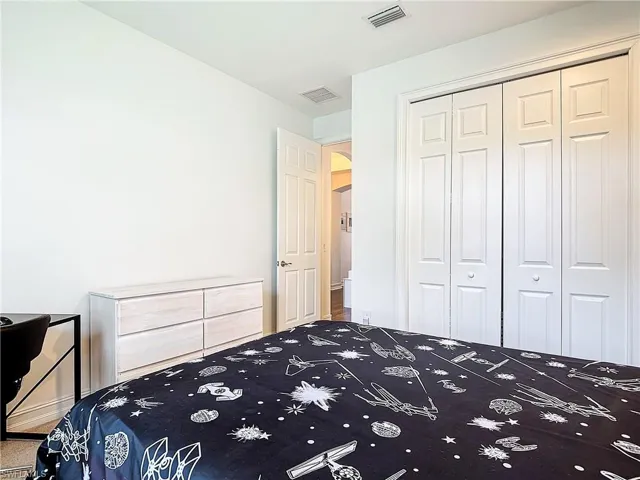 Unfurnished bedroom with a closet and carpet floors
