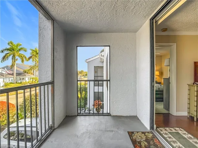 Balcony featuring a sunroom