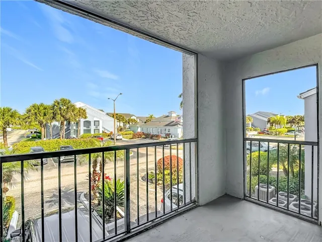 Balcony featuring a sunroom