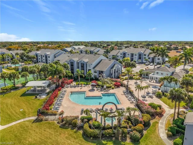 Aerial view of residential area featuring a pool