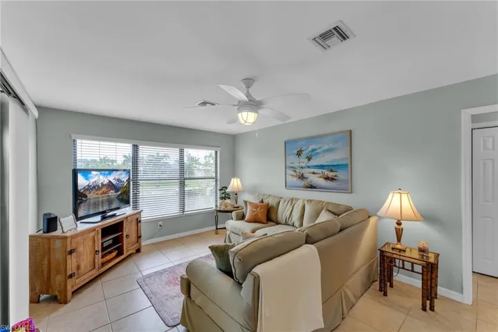 Tiled living room with ceiling fan