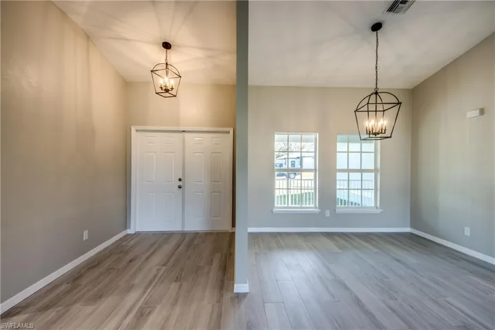 Foyer featuring a chandelier and light wood-type flooring