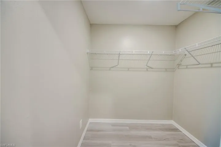 Walk in closet featuring light wood finished floors