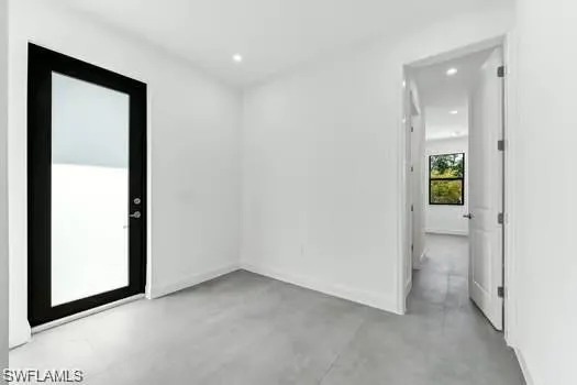 2nd Bedroom in Second Unit, room featuring concrete flooring and recessed lighting