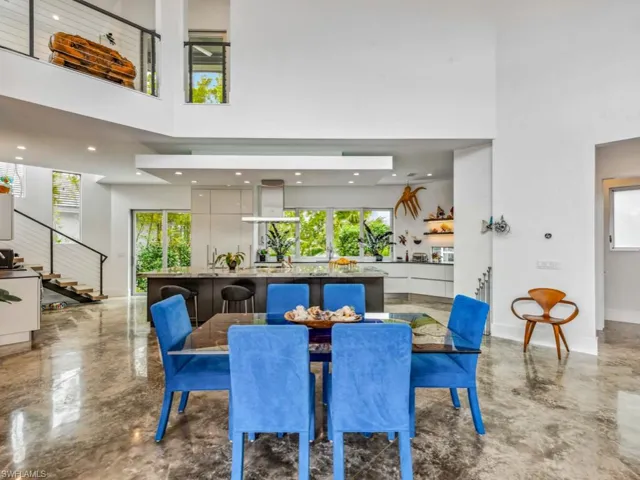 Dining space with a high ceiling and a wealth of natural light