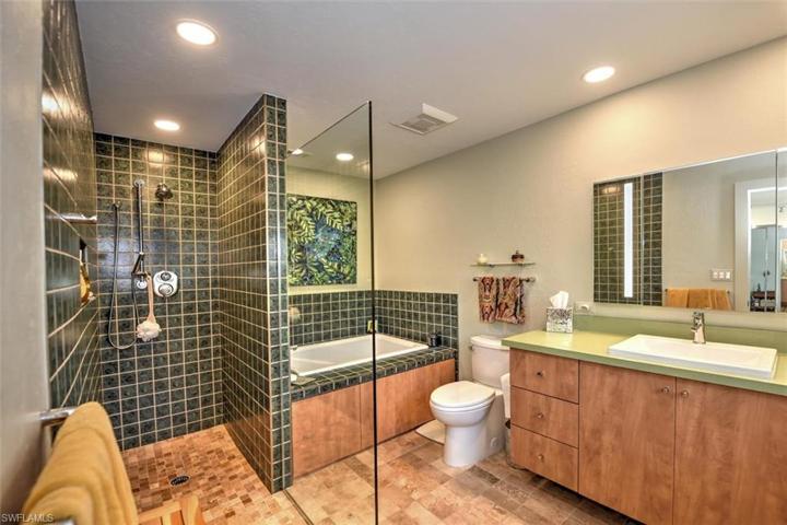 with walk in shower and soaking tub